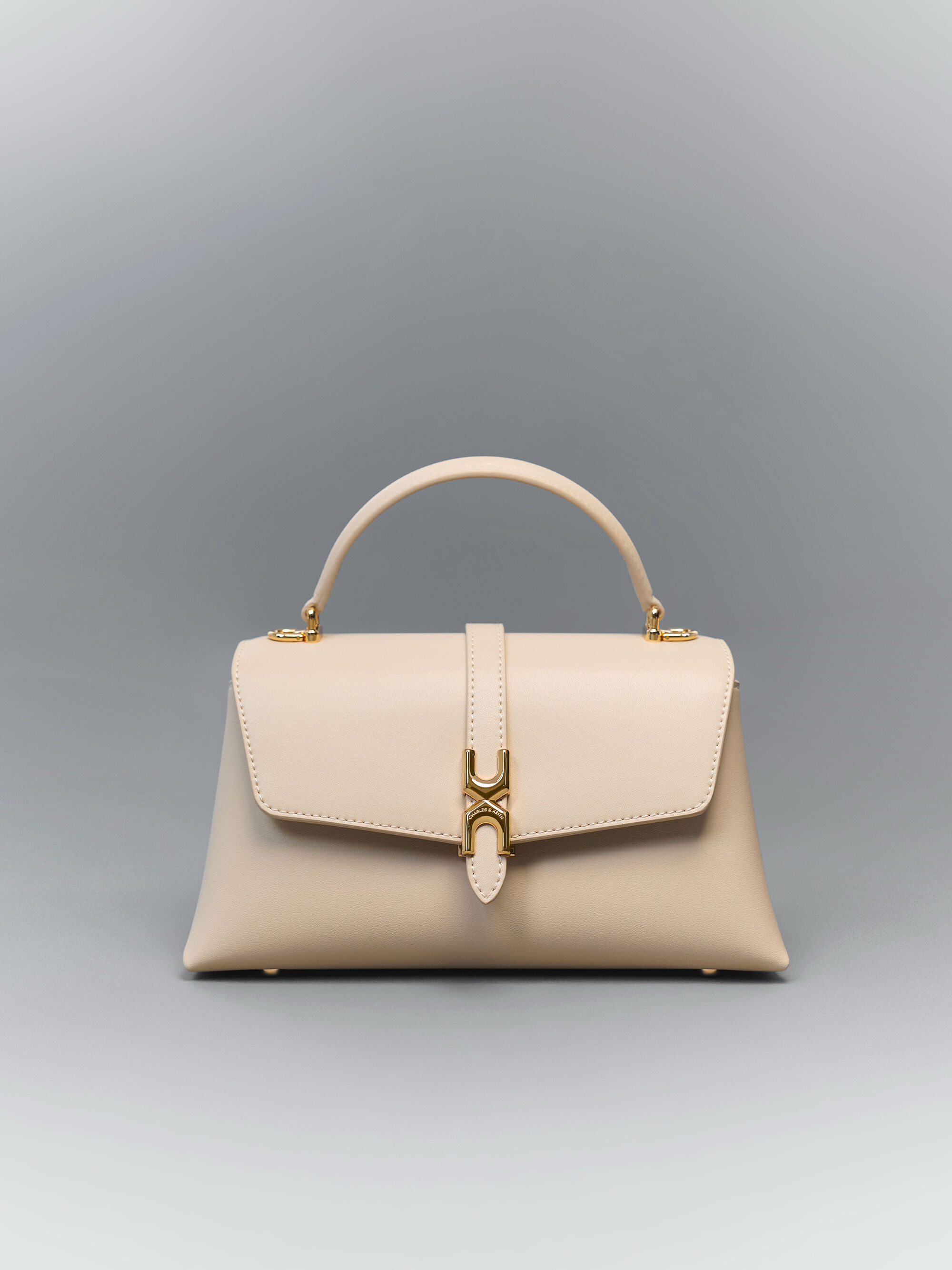 Adalyn アダリン メタリックバックル チェーンストラップ トップ