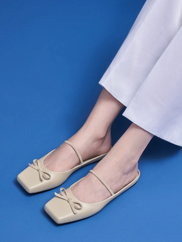 Beige bow square-toe ballet mules are ideal for the office.
