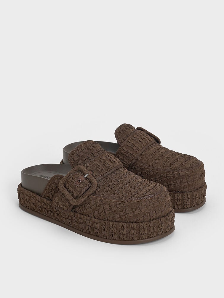 Flatform mules combine a thick, flat sole with a backless design, offering comfortable elevation and slip-on convenience.