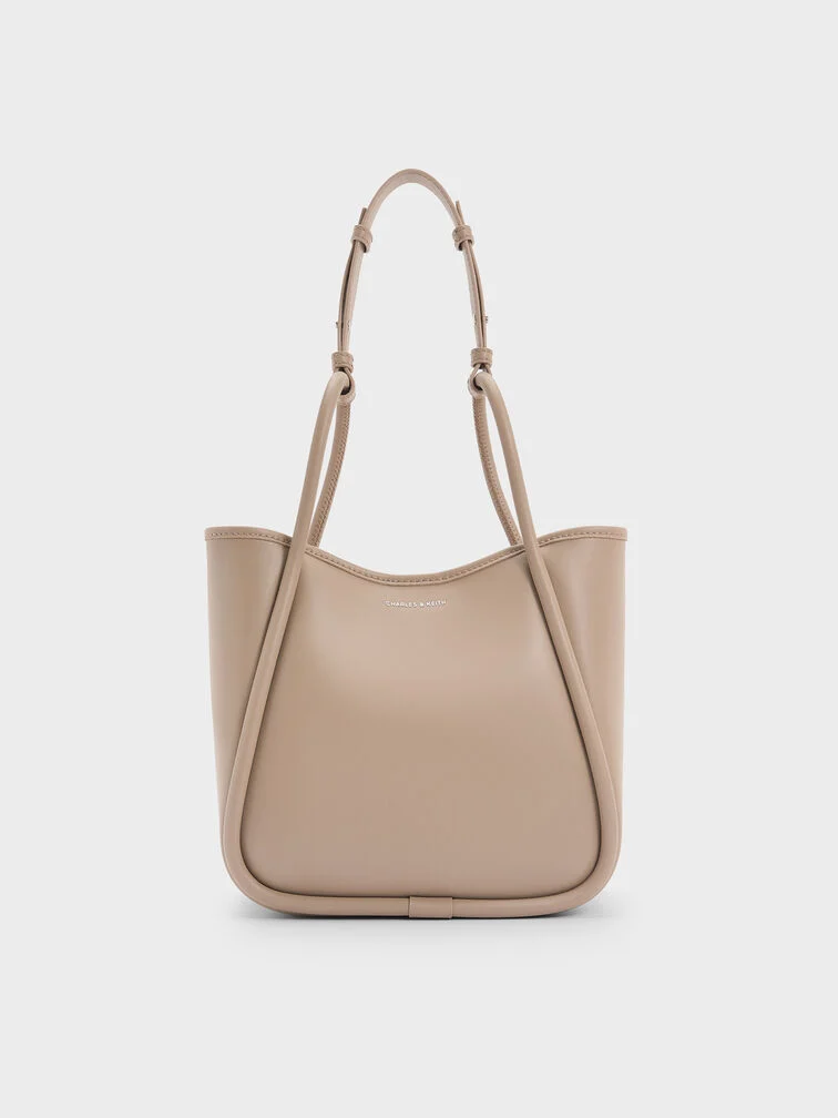 The mini Lyla tote with its opening unclipped.