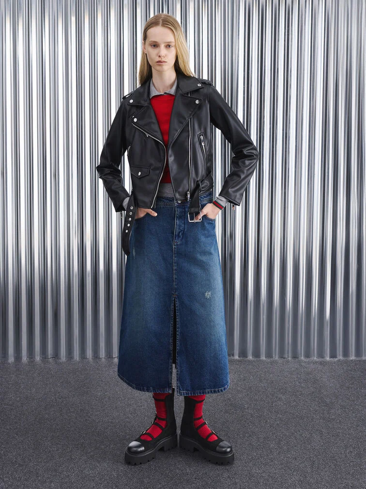 Versatile black chunky calf boots, styled with a leather jacket, denim skirt and red socks.