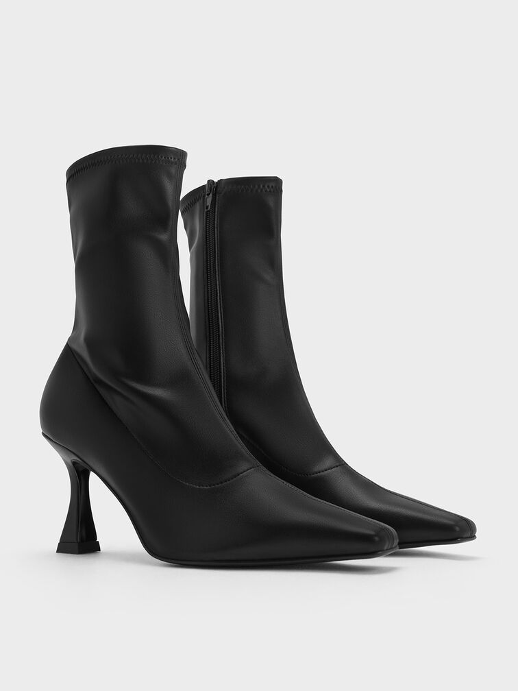 Sock ankle boots with close-fitting shafts and sculptural heels.