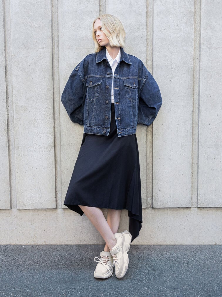 White sneakers paired with a structured denim jacket, a white button-up shirt, and a black draped skirt - CHARLES & KEITH