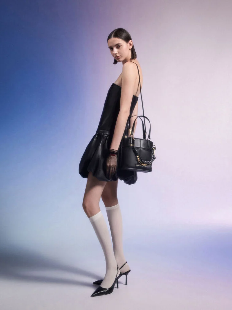 A little black dress and black pumps for a foolproof, party-ready outfit