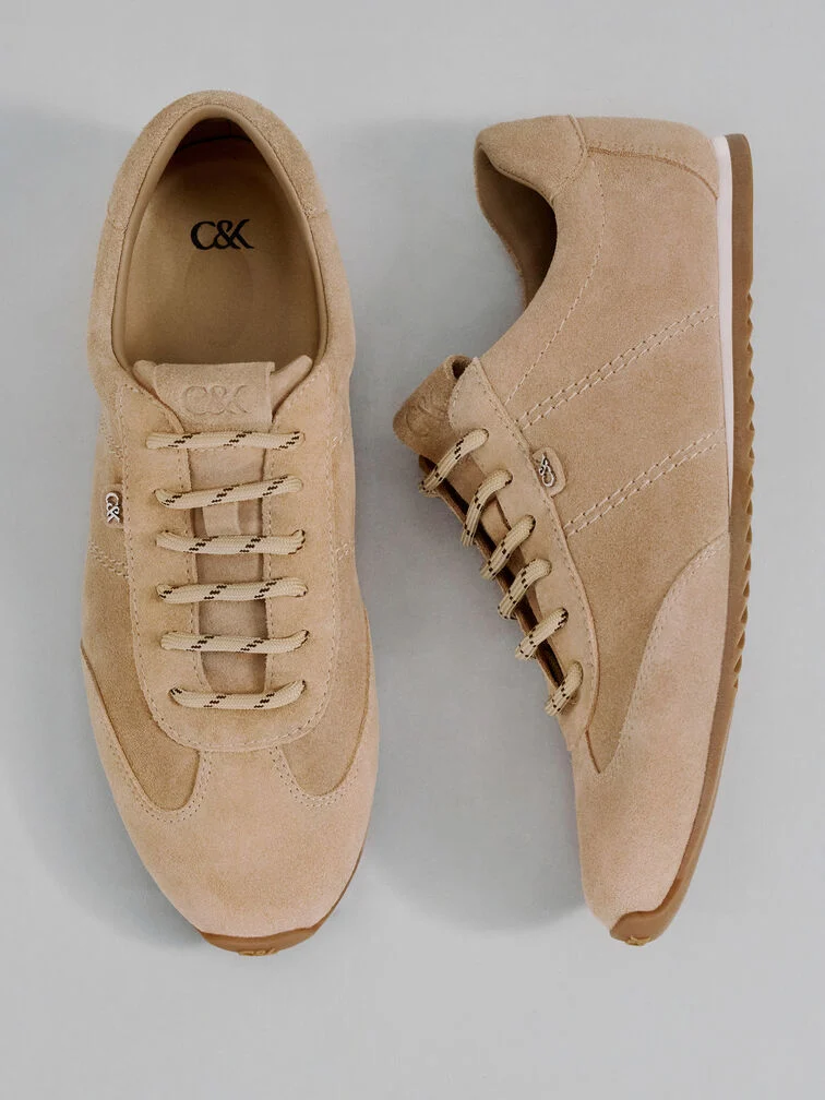  Low-profile sneakers that are made with earth-tone suede have a luxurious appearance that will look right at home at a business-casual event. 